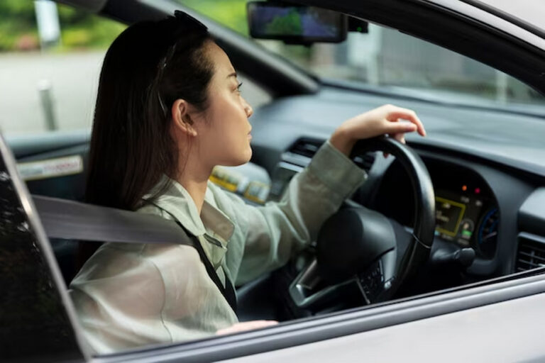 Woman in a right-hand drive car.